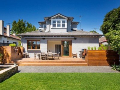 a house with a lawn and chairs