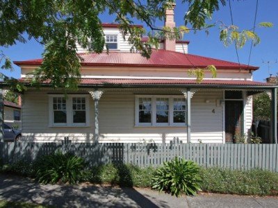 a house with a white picket fence