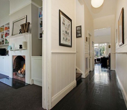 a hallway with a fireplace