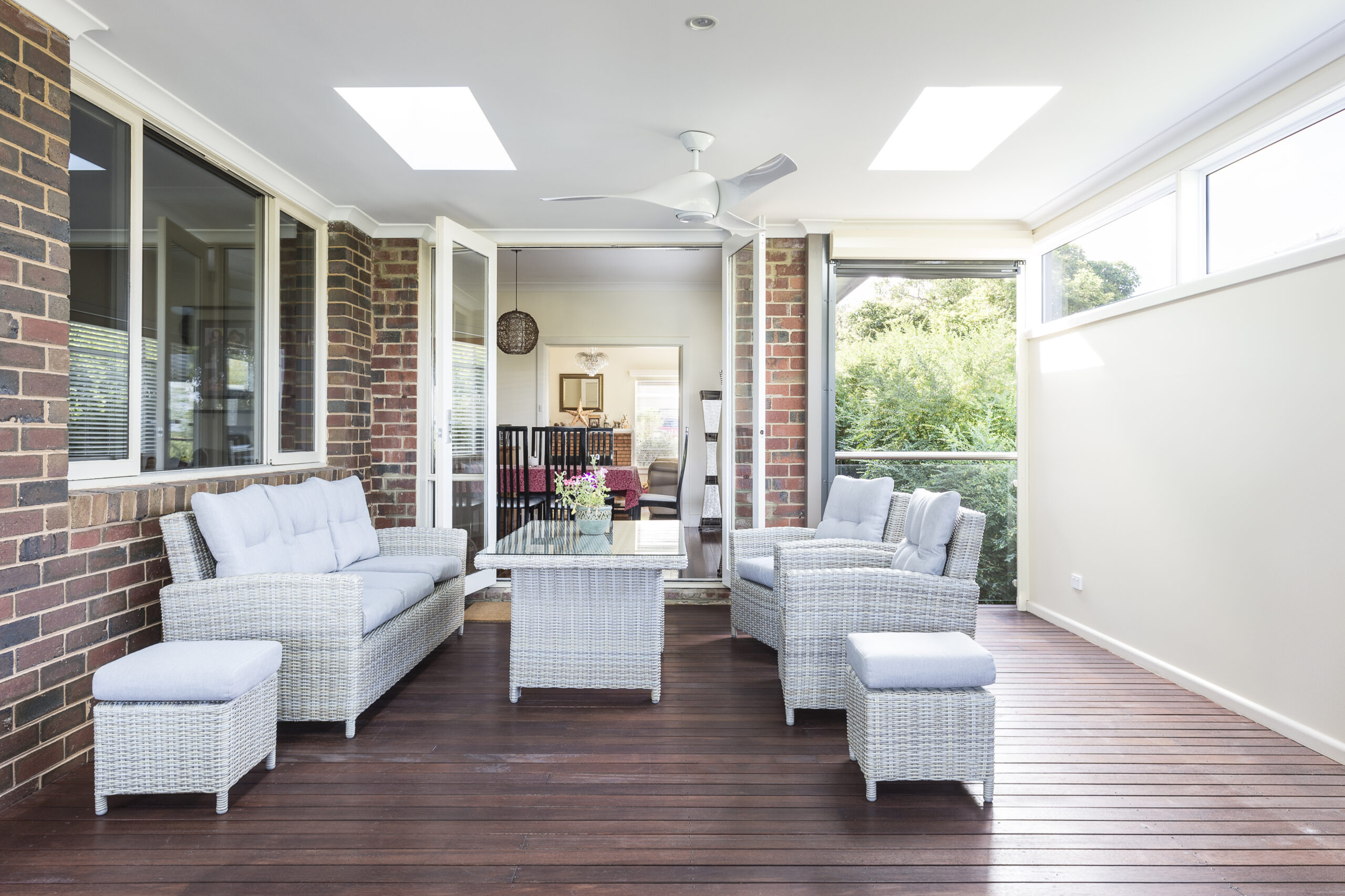 a living room with white couches