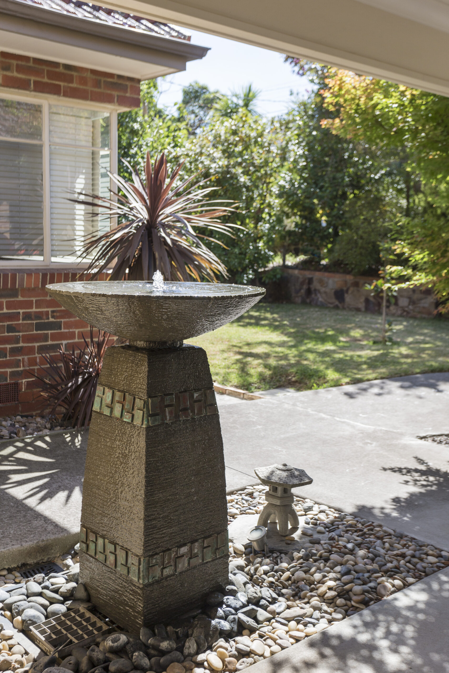 a fountain in a yard