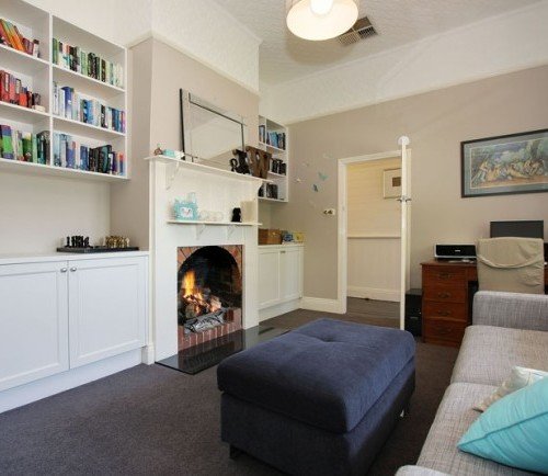 a living room with a fireplace