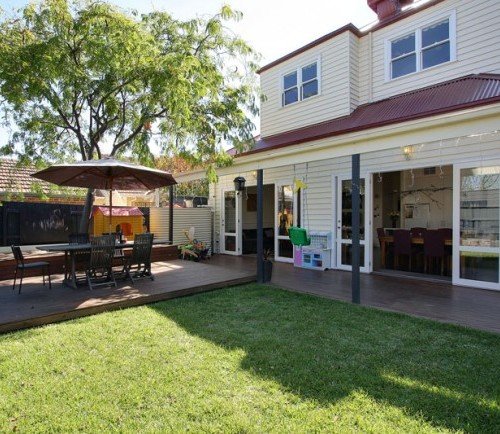 a building with tables and chairs outside