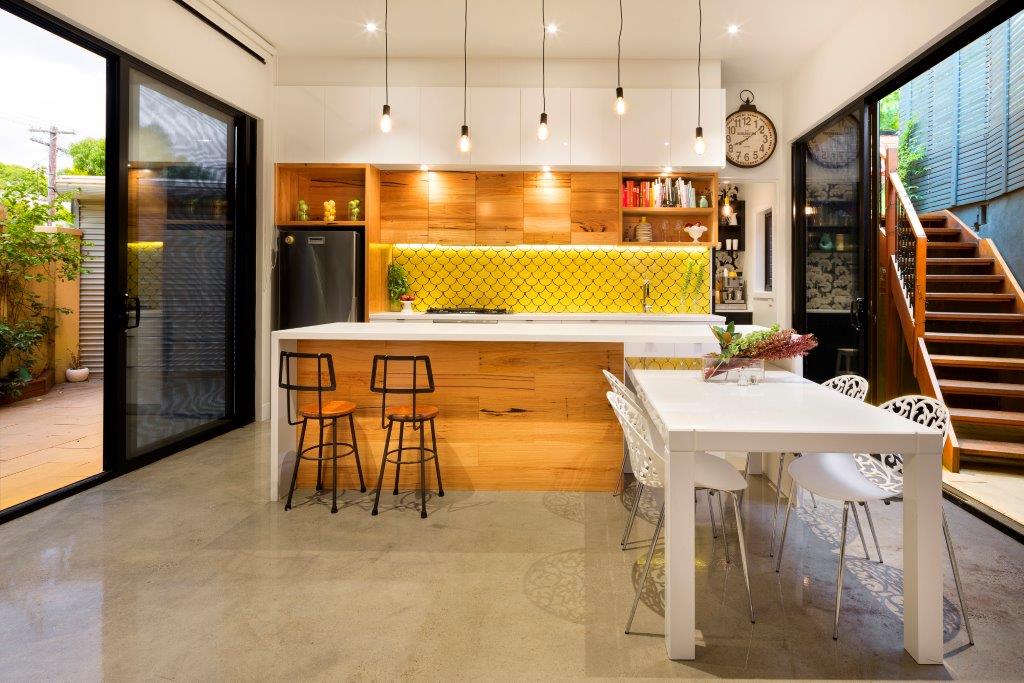 a kitchen with a table and chairs