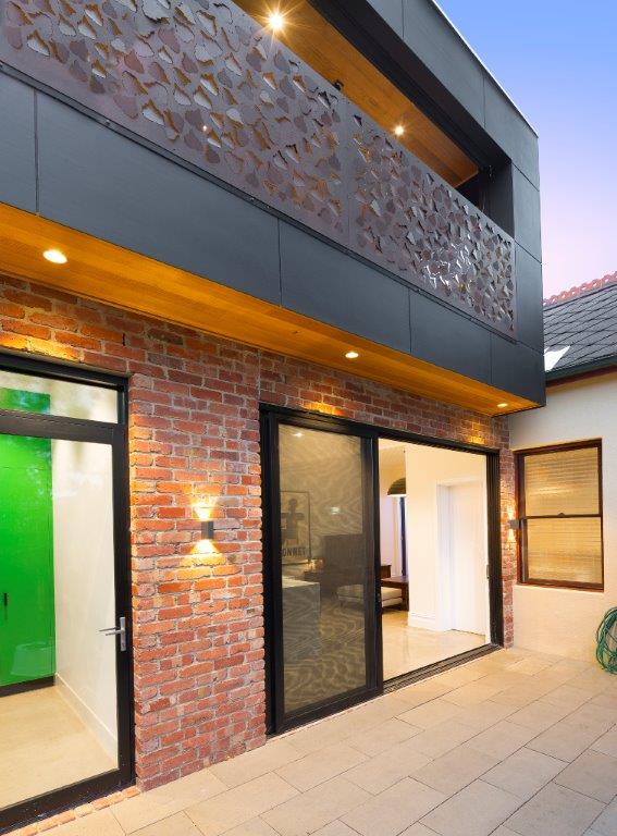 a brick building with glass doors