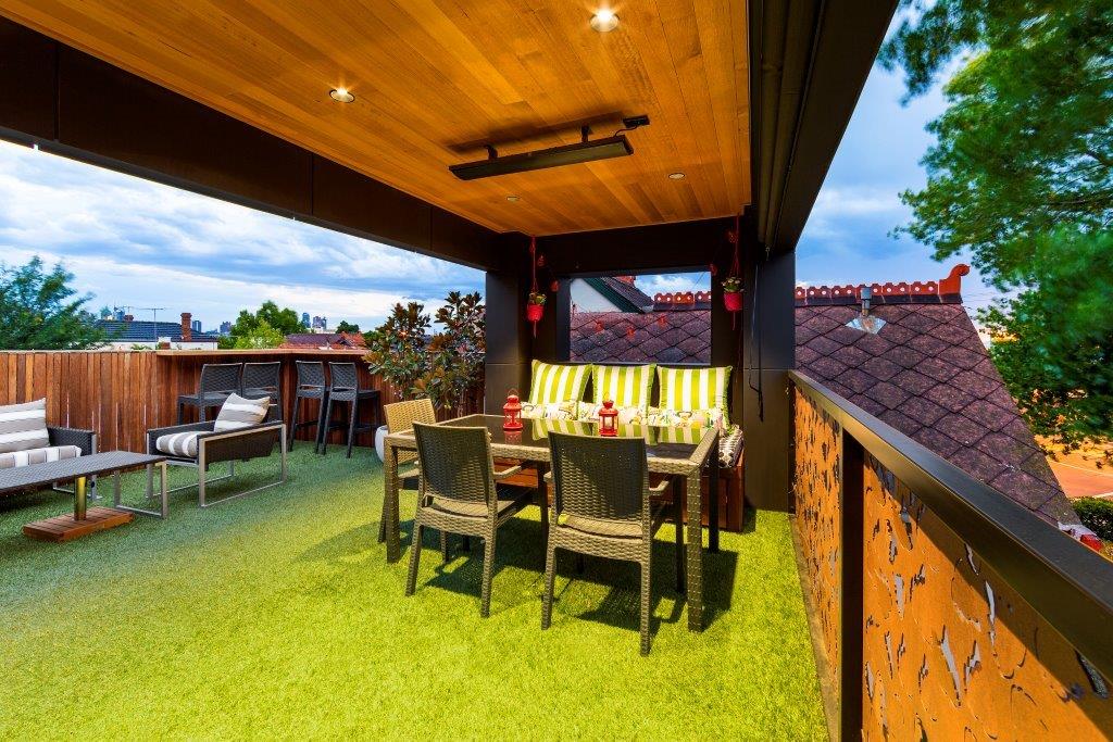 a backyard with a table and chairs