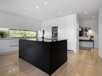 a kitchen with white cabinets