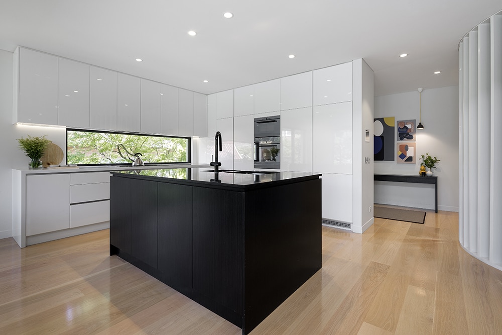 a kitchen with white cabinets