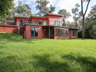 a red house with a lawn