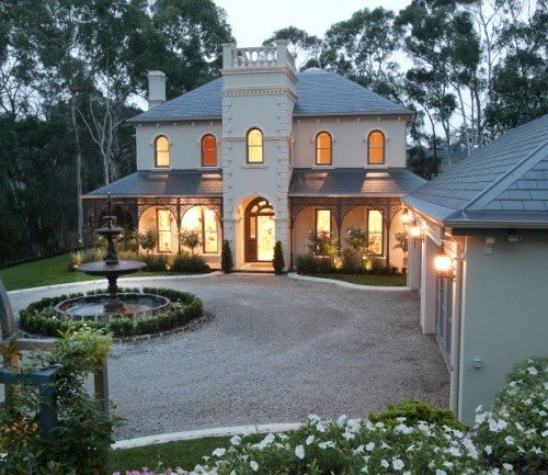 a house with a fountain in the front