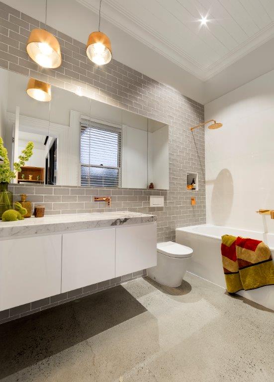 a bathroom with a tub sink and toilet