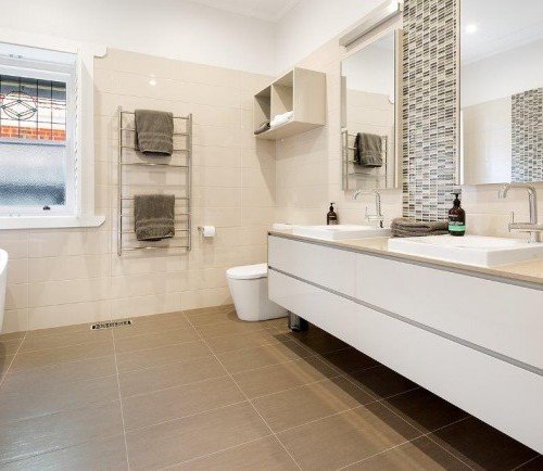 a bathroom with a tub sink and toilet