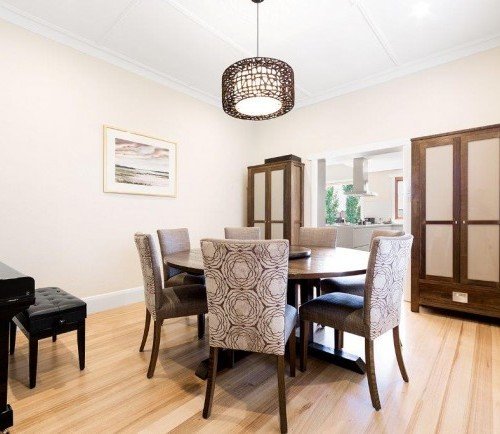 a dining room with a chandelier and a table