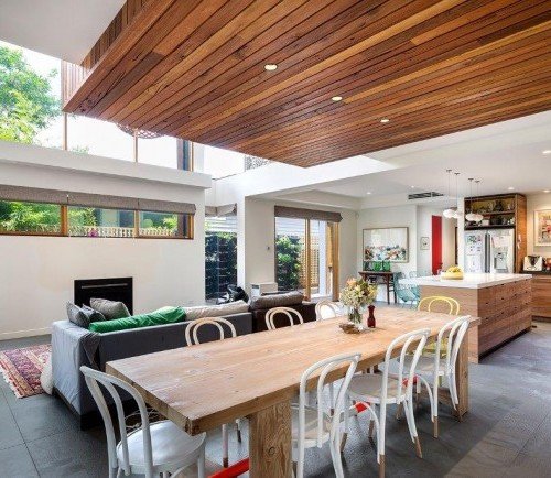 a living room with a table and chairs