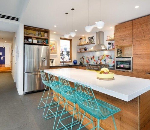 a kitchen with a table and chairs