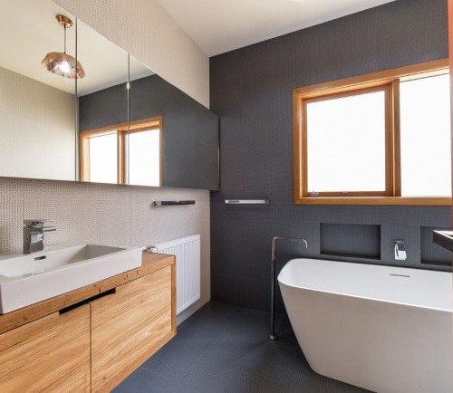 a bathroom with a tub sink and a bathtub