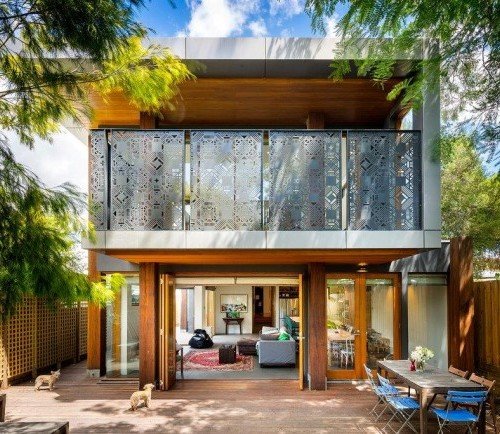 a house with a patio and a table and chairs