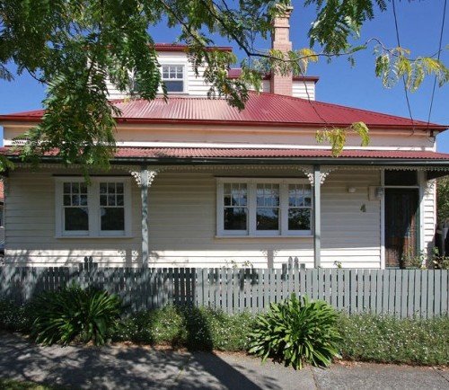 a house with a white picket fence