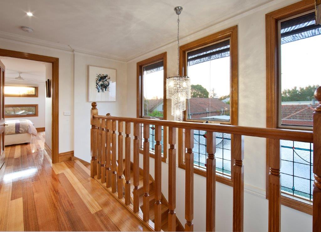 a room with a wood staircase