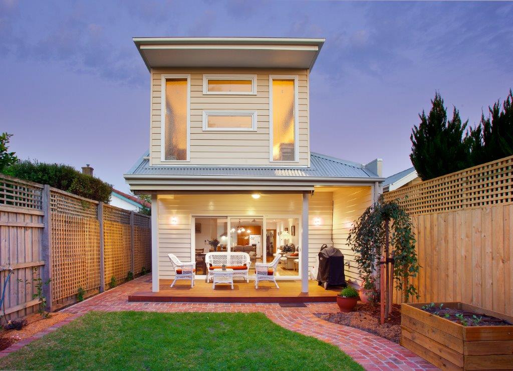 a house with a fence and a lawn