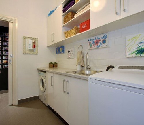 a kitchen with white cabinets