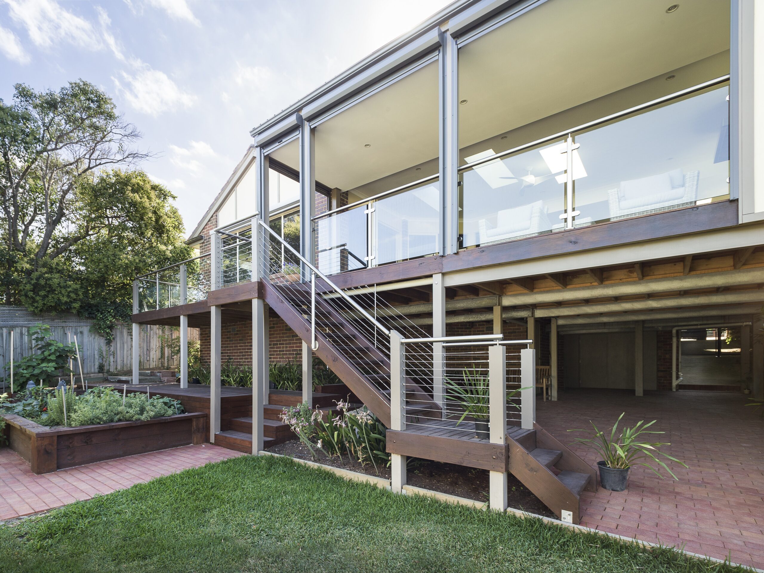 a house with a deck and grass