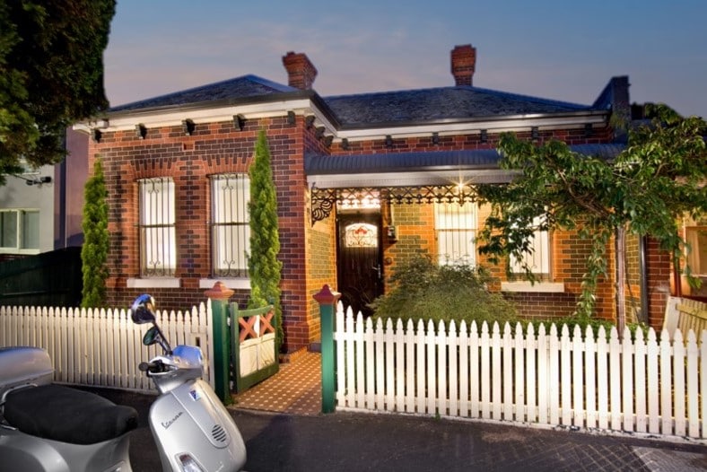 a house with a white picket fence