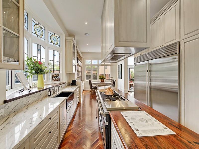 a kitchen with white cabinets