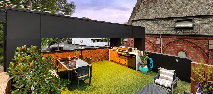 a backyard with a table and chairs