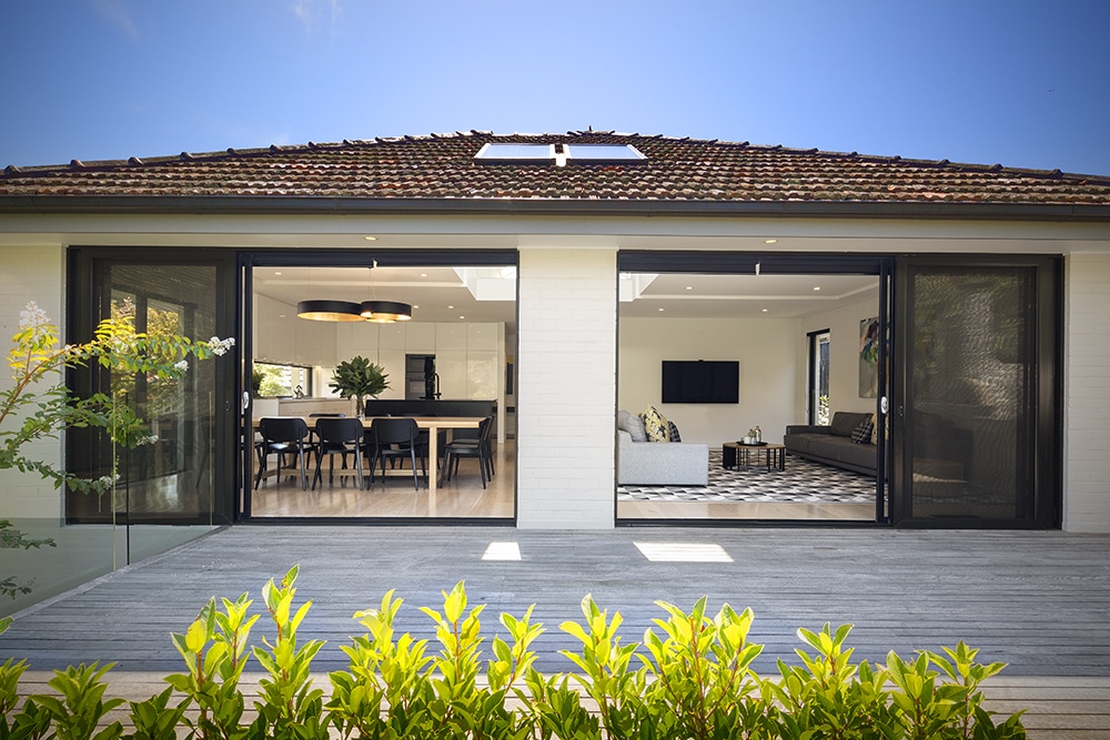 a house with a patio and a table and chairs