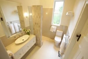 a bathroom with a sink toilet and a shower