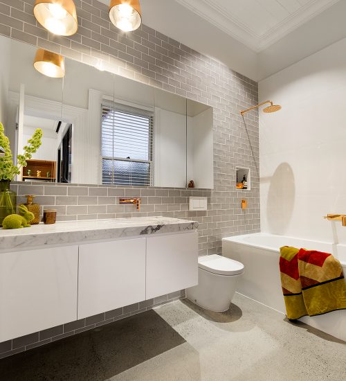 a bathroom with a tub toilet and sink