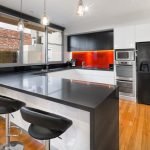 a kitchen with black appliances