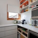 a kitchen with a microwave oven and coffee maker