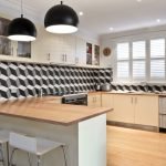 a kitchen with white cabinets