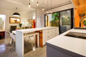 a kitchen with white cabinets