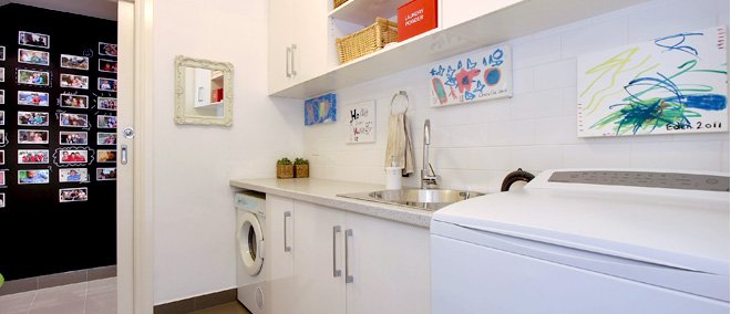 a kitchen with white cabinets