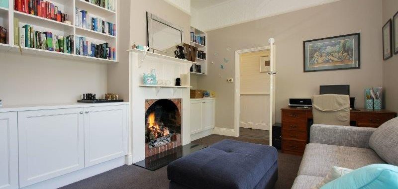 a living room with a fireplace