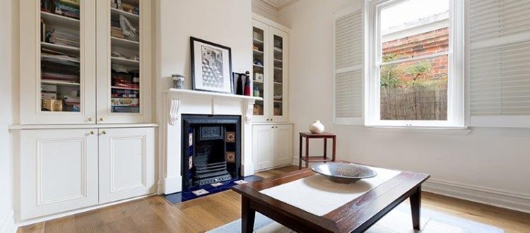 a living room with a fireplace