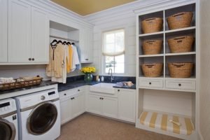 a kitchen with white cabinets