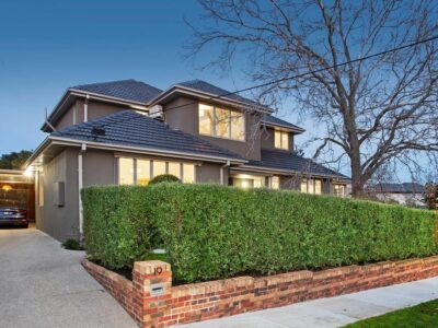 a house with a brick driveway