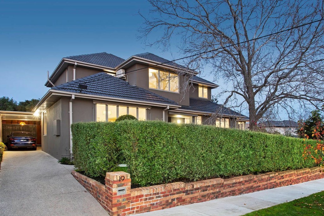 a house with a brick driveway