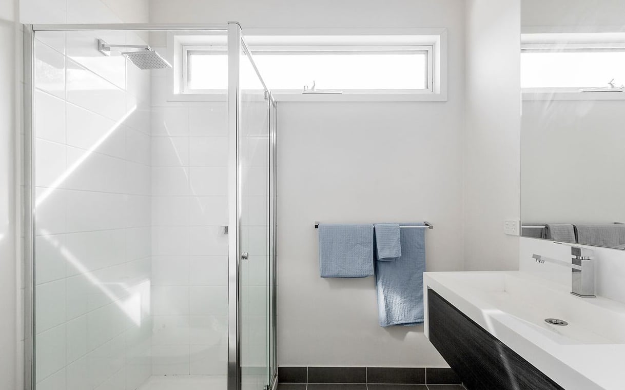 a bathroom with a glass shower