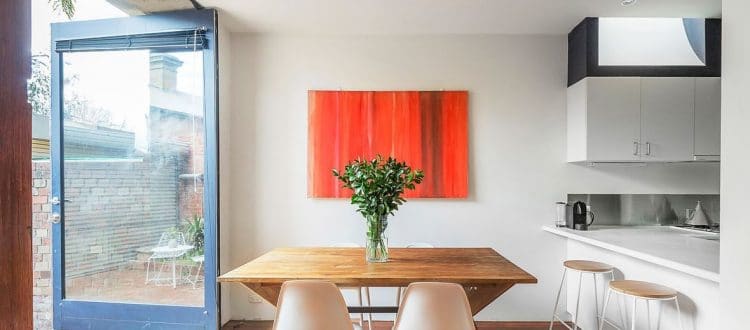 a kitchen with a table and chairs