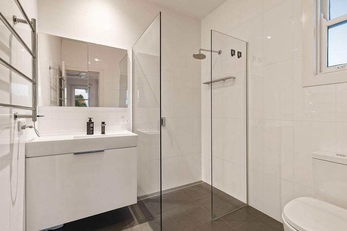 a bathroom with a glass shower