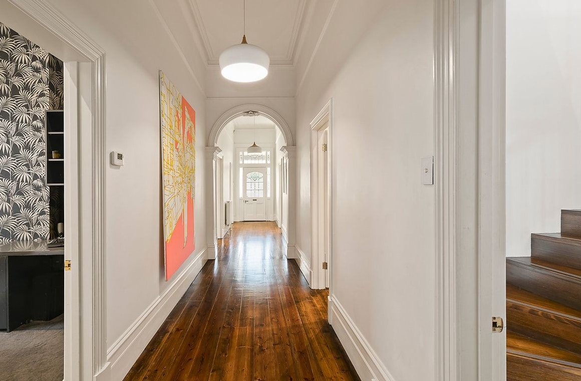 a hallway with white walls