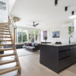 a kitchen with a wood staircase