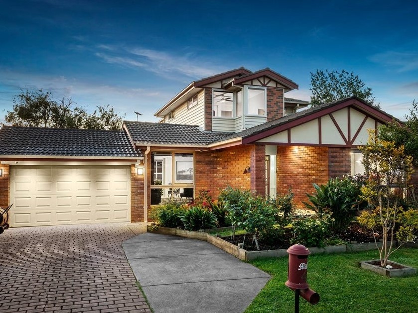 a house with a brick driveway