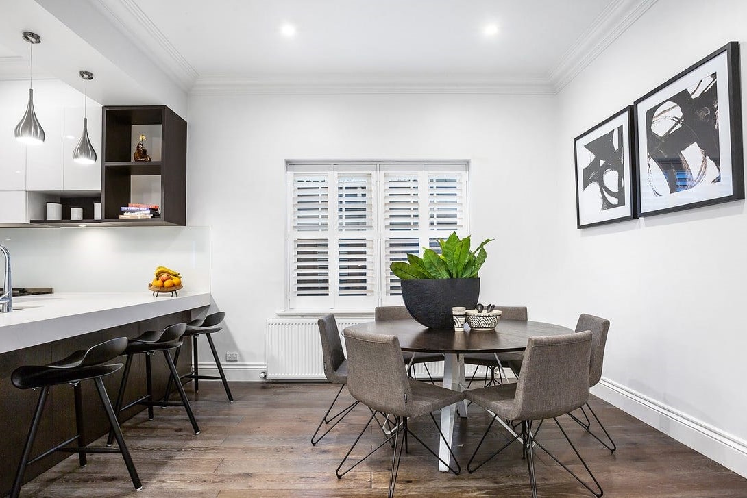 a kitchen with a table and chairs