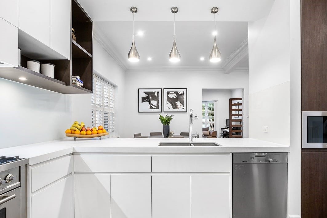 a kitchen with a sink and a dishwasher